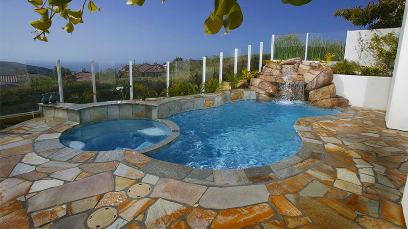 High on a hill overlooking the Newport Coast, water cascades through an intimate grotto, sculpted from stone that is both natural and artificial. The judges of the 2004 NSPI Design Awards felt the effect was entirely natural, and awarded it the Bronze medal.