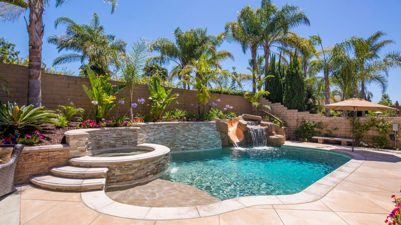 Backyard Staycation with Something for Everyone.  Swan Pools custom swimming pools build.