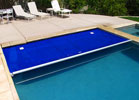 Click on the picture for a larger image of an Automatic Pool Cover in action.