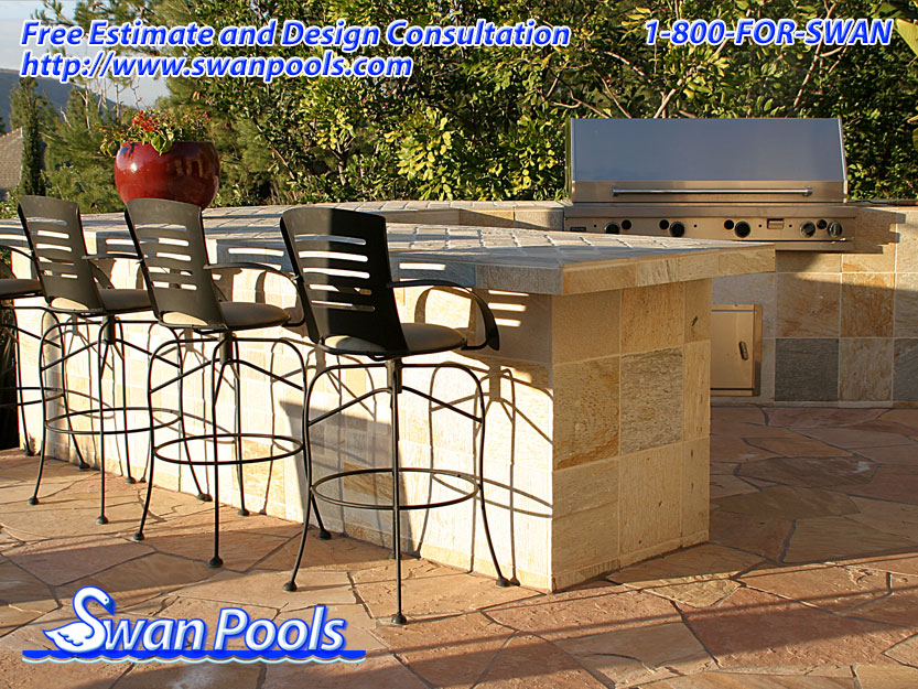 Custom shape, modern barbeque with tile top, tile sides, and serving shelf.