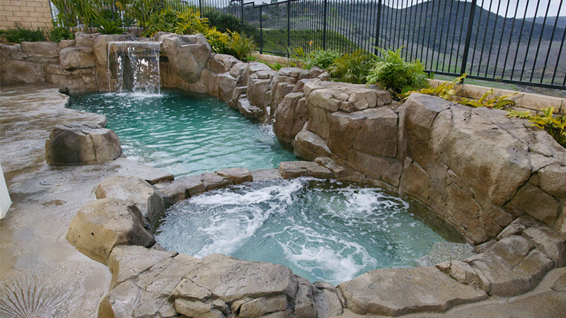 Swan Pools, a custom swimming pool company, excels in building rocky outcropings, fossilized concrete decking, large waterfalls, and bubbling water wisk you away to your very own natural hot spring.  Relax and let Mother Earth speak to you.