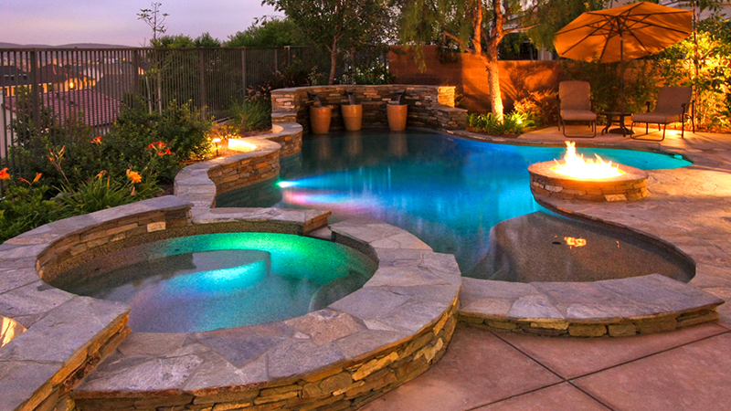 Swimming pool and spa party time with this complete swimming pool construction and entertainment area.